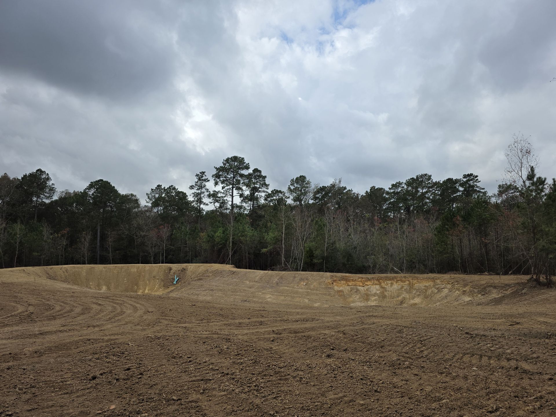 Excavated Basin To Finished Pond before
